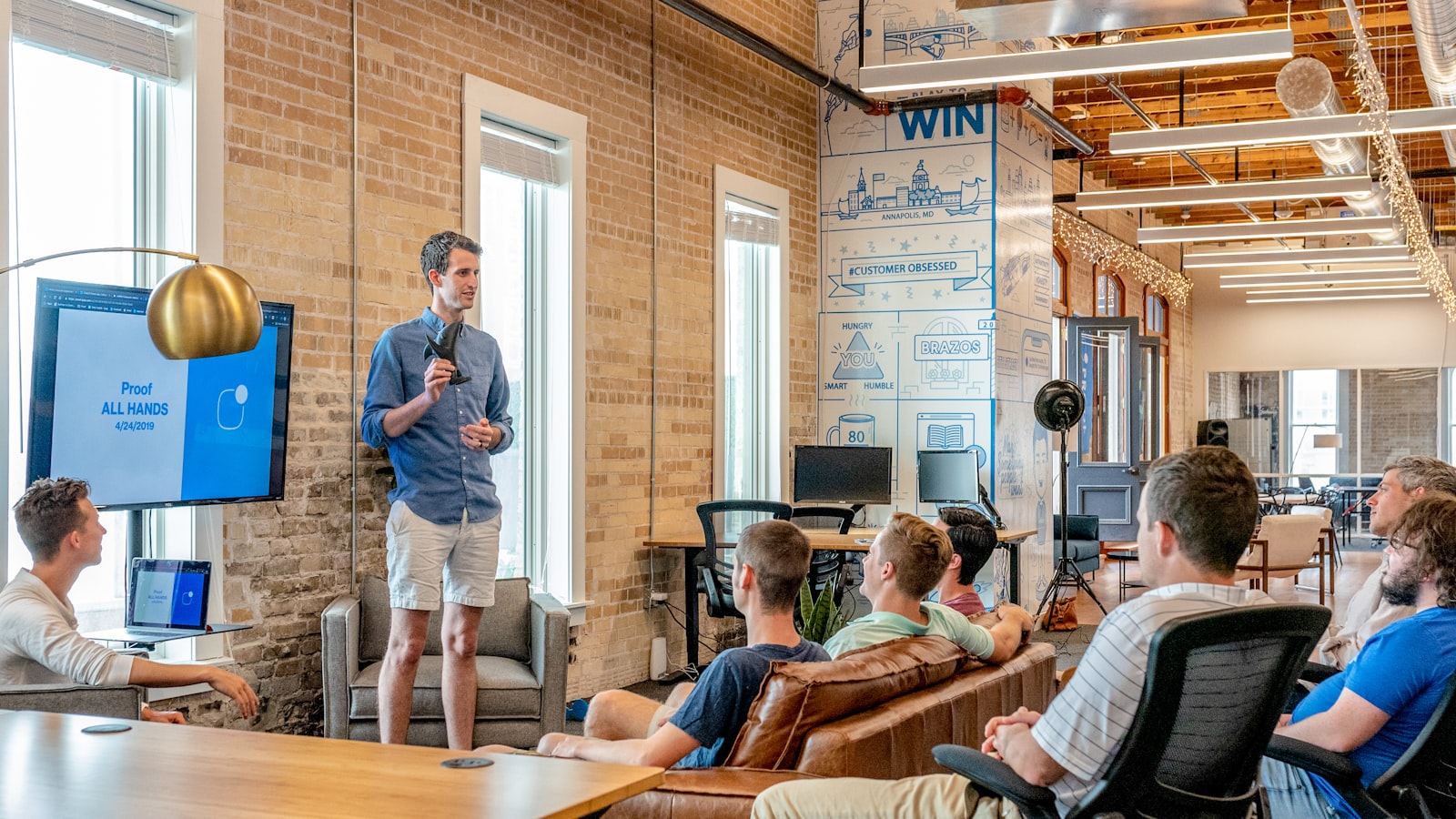 Founder presenting visa petition preparation services to a team
